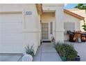 Front entry with walkway, door, and some plants at 4313 Scarlet Sea Ave, North Las Vegas, NV 89031