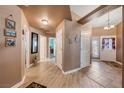 Light and bright entryway with tile and wood flooring at 5481 Lincolnwood Ct, Pahrump, NV 89061