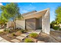 Modern home exterior with landscaped walkway at 21 Highland Cove Ln, Henderson, NV 89011