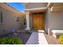 Elegant front entry with double doors and stone pathway at 3013 High Range Dr, Las Vegas, NV 89134