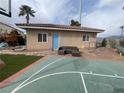 Backyard with basketball court, guest house, and play area at 6228 Dartle St, Las Vegas, NV 89130