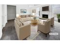 Virtually staged living room with fireplace and neutral decor at 6609 Pepperidge Way, Las Vegas, NV 89108