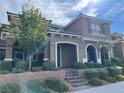 Two-story house with attractive landscaping and a front porch at 2818 Turnstone Ridge St, Henderson, NV 89044