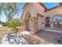 Stone accented entryway with arch and walkway at 3689 Callahan Ave, Las Vegas, NV 89120