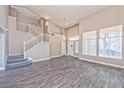 Spacious living room with high ceilings and gray flooring at 7905 Sierra Rim Dr, Las Vegas, NV 89131