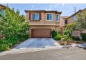 Beautiful two-story house with attached garage and well-manicured landscaping at 7703 Frenchmans Bay Ave, Las Vegas, NV 89179