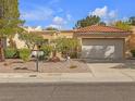 Single-story home with tile roof, attached garage, and nicely landscaped yard at 2012 Bellview St # 0, Las Vegas, NV 89134