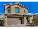 Two story house with brown garage door and landscaped yard at 2796 Sipe Springs St, Las Vegas, NV 89142