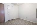 Simple entryway with tiled floor and white door at 3843 Terrazzo Ave # 0, Las Vegas, NV 89115