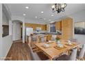 Eat-in kitchen with wood cabinets and granite countertops at 6920 Winter Ridge St, Las Vegas, NV 89149