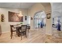 Casual dining area with hardwood floors and an open floor plan at 823 Sea Pines Ln, Las Vegas, NV 89107