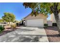 One-story house with white garage door and driveway at 9522 Palini Ct, Las Vegas, NV 89123