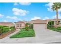 Single story home with front yard landscaping and driveway at 10717 Grand Cypress Ave, Las Vegas, NV 89134