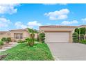 Single-story house with landscaped yard, attached garage, and walkway at 10717 Grand Cypress Ave, Las Vegas, NV 89134