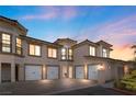 Luxury townhome with three garages and manicured landscaping at 20 Via Visione # 105, Henderson, NV 89011