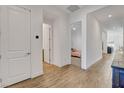 Bright hallway with wood floors and access to bedroom and bathroom at 829 Stepney Pl, Henderson, NV 89011