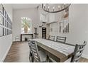 Bright dining room with a large table and hardwood floors at 8951 Daylight Peak Ct, Las Vegas, NV 89123