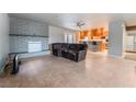 Spacious living room featuring a fireplace and kitchen views at 4010 E Twain Ave, Las Vegas, NV 89121