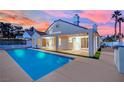 Inviting blue rectangular pool with a patio and pergola at 7457 Painted Shadows Way, Las Vegas, NV 89149