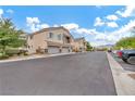 Townhome community with parking and landscaping at 6041 Riverwalk Falls St # 102, North Las Vegas, NV 89031