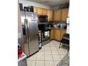 Bright kitchen featuring stainless steel appliances and wood cabinets at 5055 W Hacienda Ave # 2077, Las Vegas, NV 89118