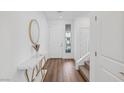 Bright entryway with hardwood floors and a staircase at 8731 Black Cordon Rd, Las Vegas, NV 89139