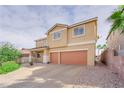 Two story house with two car garage and landscaping at 76 La Fiesta St, Henderson, NV 89012