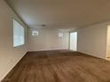 Spacious living room with neutral carpeting and large windows at 5264 Steptoe St, Las Vegas, NV 89122