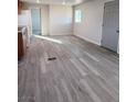 Kitchen with light wood cabinets and vinyl plank flooring at 1080 Shady Ln, Pahrump, NV 89060