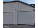 Two-car garage with white doors at 321 Bent Creek Dr, Las Vegas, NV 89107