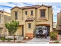 Two-story house with attached garage and landscaped yard at 9105 Parapet Ave, Las Vegas, NV 89149