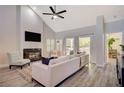 Living room features a fireplace, hardwood floors and a view to the backyard at , Las Vegas, NV 89113