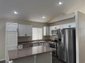 Modern kitchen with stainless steel appliances and granite countertops at 9124 Sapphire Point Ave, Las Vegas, NV 89147