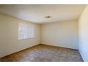 Simple bedroom with tiled floor and window coverings at 825 Hedge Way # 4, Las Vegas, NV 89110