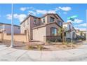 Two-story house with a brown garage door and orange accents at 301 La Musica Pl, Henderson, NV 89015