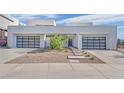 Two-story home with modern facade and two-car garage at 28 Rainbow Point Pl, Henderson, NV 89011