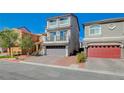 Two-story home with gray siding and a two-car garage at 5960 Aurora Gold Ave, Las Vegas, NV 89141