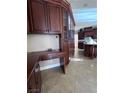 Built-in kitchen desk with corner cabinetry and wood flooring at 2208 Fiero Dr, Las Vegas, NV 89134