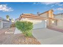 Single-story home with attached garage and well-maintained landscaping at 4187 Heller Dr, Las Vegas, NV 89115