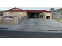 House exterior featuring a carport and a white fence at 5530 Plainview Ave, Las Vegas, NV 89122