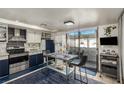 Kitchen with stainless steel appliances and a dining area at 2080 Karen Ave # 94, Las Vegas, NV 89169