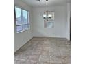 Bright dining room with tile floors and a chandelier at 6226 Buffalo Spring Ct, Las Vegas, NV 89122