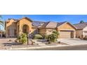 Single story home with solar panels and desert landscaping at 7126 Spindle Berry St, Las Vegas, NV 89131