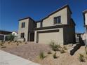 Two-story house with attached garage and landscaped front yard at 9398 Ara Place, Las Vegas, NV 89143