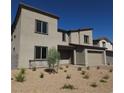 Two-story house with attached garage and landscaped front yard at 9398 Ara Place, Las Vegas, NV 89143