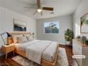 Bright bedroom with hardwood floors and plenty of natural light at 7942 Quail Mountain Ln, Las Vegas, NV 89131