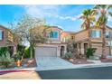 Two-story house with attached garage and desert landscaping at 9163 Denver Sky Ave, Las Vegas, NV 89149