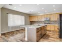 Spacious kitchen with granite island and wood cabinets at 3313 Brambling Ave, North Las Vegas, NV 89084