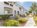 Condo building exterior with walkway and landscaping at 700 Carnegie Street # 2312, Henderson, NV 89052