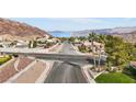 Aerial view of a residential street with lake and mountain views at 639 Marina Dr, Boulder City, NV 89005